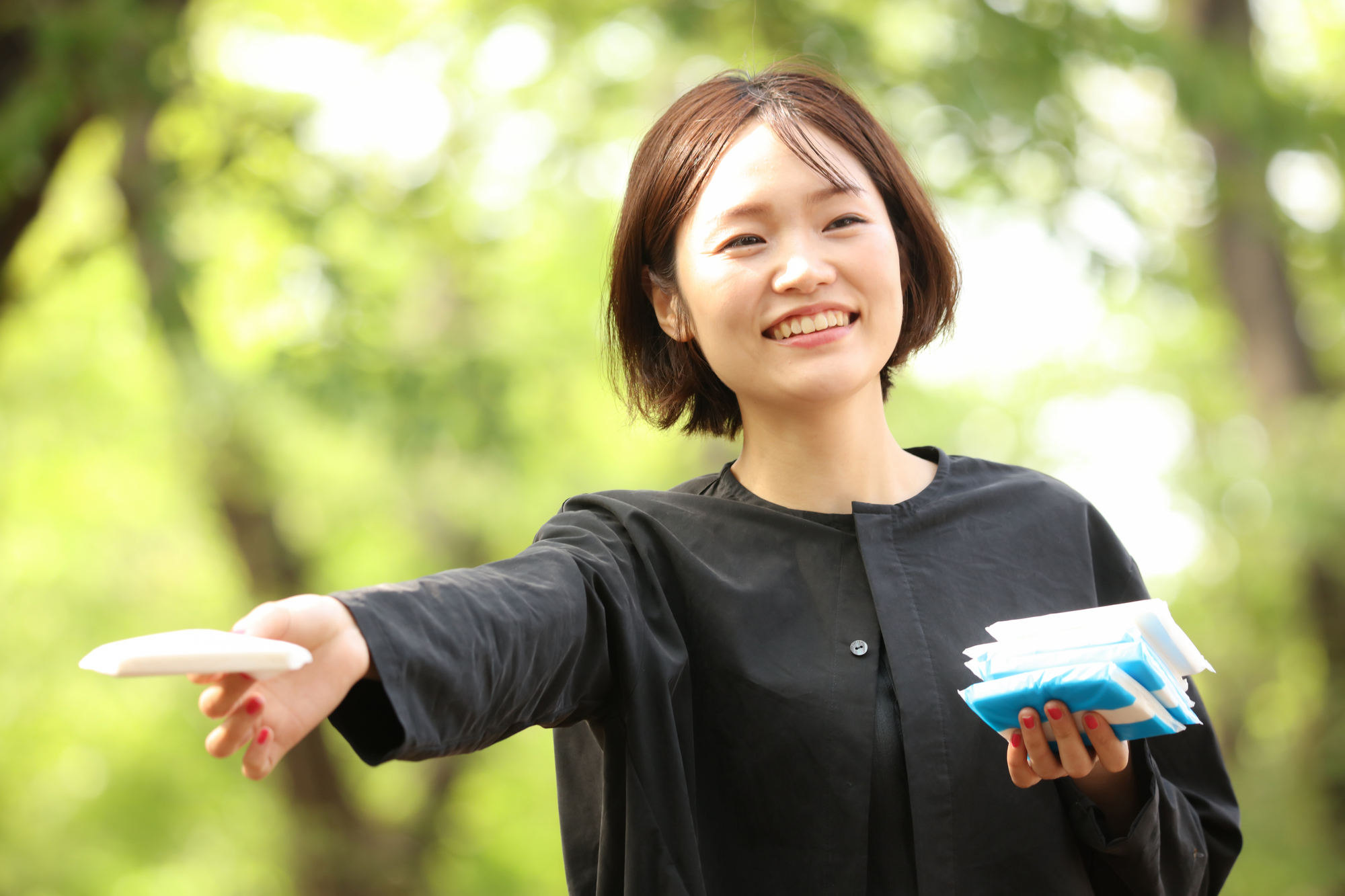 Woman handing out tissues